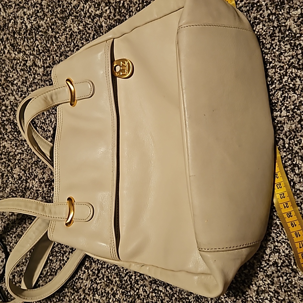 Liz Claiborne Leather Co. Purse. Color  Off white with gold. Shows signs of wear